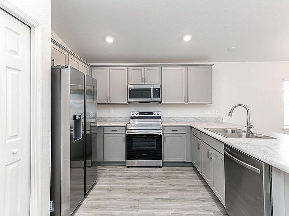Your new kitchen includes a pantry, 36-in. cabinets with crown, and Samsung SS appliances - New home