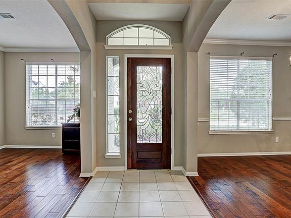 Foyer open to the formal dining & living room. Large windows provide plenty of natural light throughout!