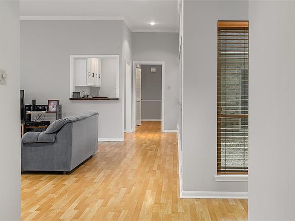 This home opens to a foyer leading into an oversize family room.