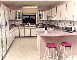 remodeled kitchen with solid surface countertops