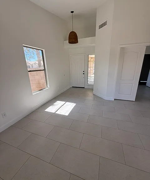 Front Entry into the great room. Vaulted ceilings make it feel huge!