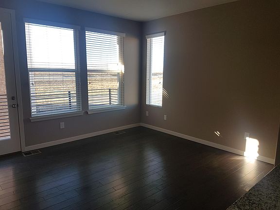 Living Room with Balcony (View) and Hardwood Floor