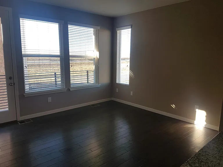 Living Room with Balcony (View) and Hardwood Floor