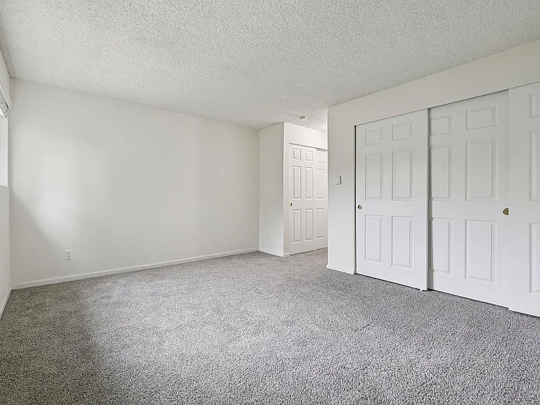 Bright, modern bedroom in Foster Creek apartment, Tukwila, WA.