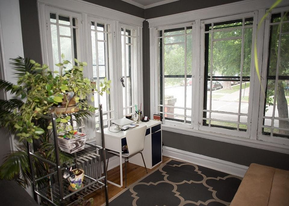 beautiful large sunroom makes you feel like you're in a treehouse