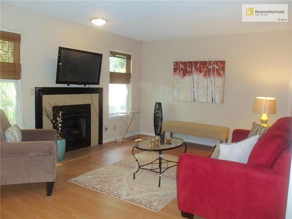 Spacious Living Room with Gas Log Fireplace and Newer Windows