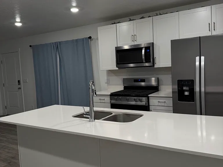 Kitchen, entering from garage door (right)