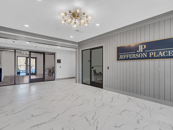 Welcome to Jefferson Place Apartments, where luxury meets comfort. Our stunning lobby features elegant design and modern amenities, creating a welcoming atmosphere. Explore available units today and elevate your living experience!