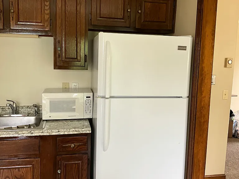 Kitchen with full fridge/freezer