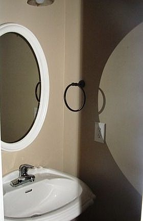 Pretty powder room off foyer