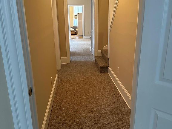 Hall from front entry room to bedroom and kitchen