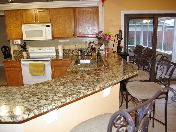 Quality granite installed on countertops and backsplashes.