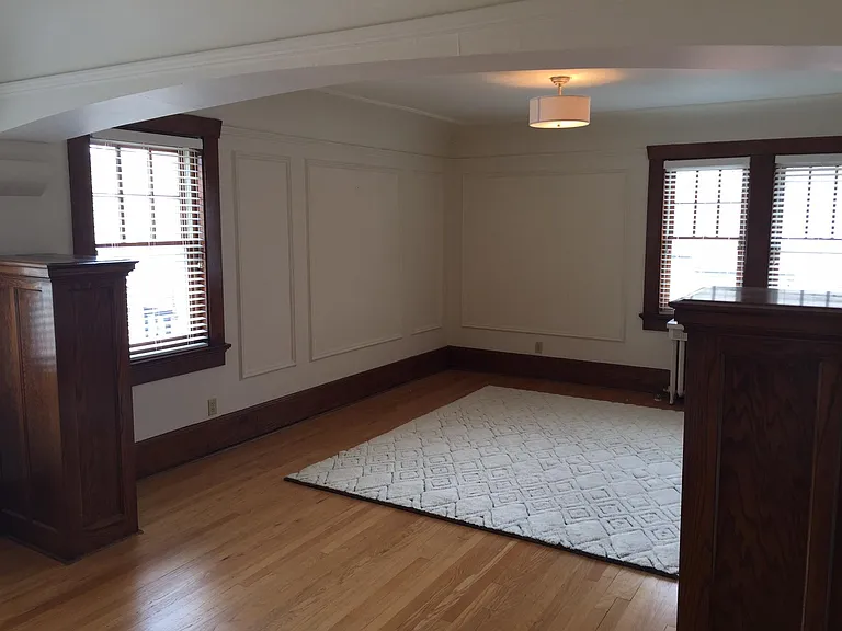 Spacious living room with lots of natural light. Blinds included.