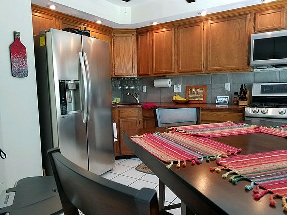 Ceramic tile floor, recessed lighting, matching updated appliances