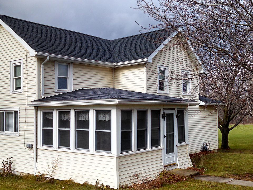 The front of the house has a nice enclosed porch.