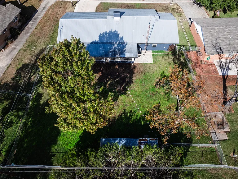 Overhead aerial view highlighting the full lot size and landscaping