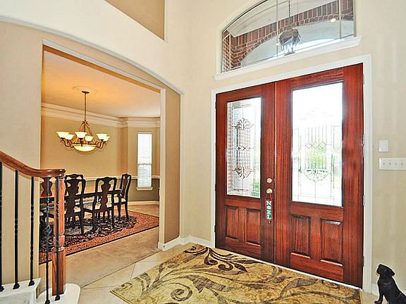 Spacious Foyer with leaded glass front door