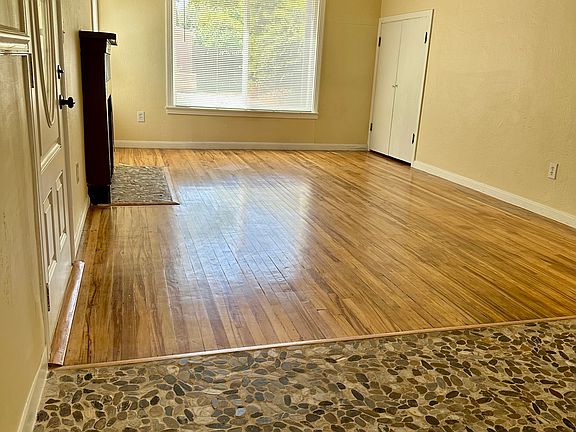 Living room w/ fireplace and storage.