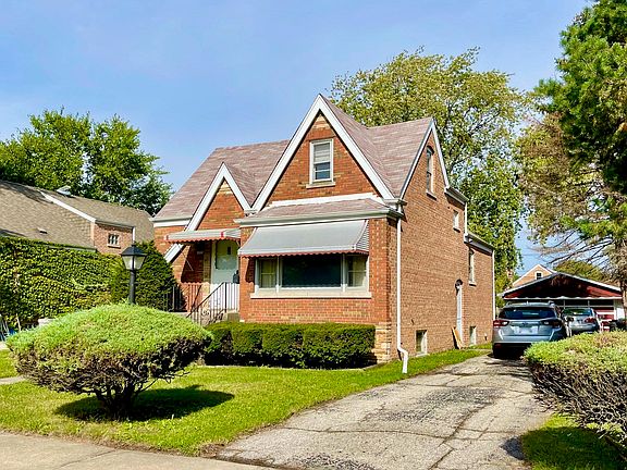 Side Drive, Side Entry, 2 car heated Garage plus 1