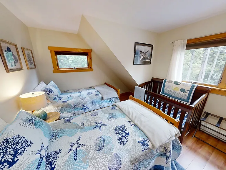 Third level bedroom 5 with 2 twin beds and crib