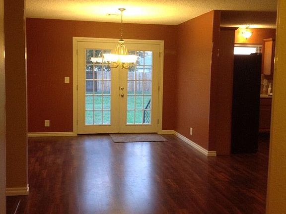Entry to family room to dining room with French doors, kitchen is to the right.