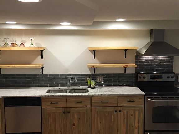 kitchen featuring Colorado blue-stained pine, marble counter