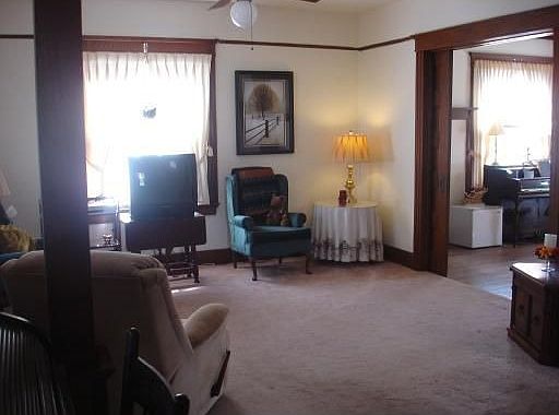 Living Room with Original Woodwork, solid pocket doors