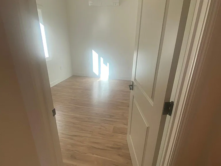 Bedroom one with Mitsubishi mini split and Hinkley ceiling fan