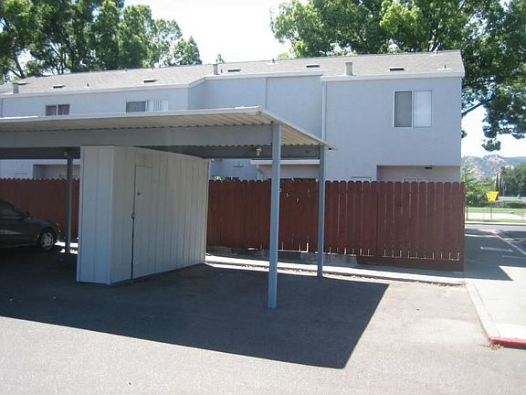 Designated covered parking with lockable storage shed