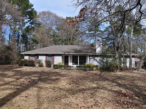 Home has covered front porch area with large windows to view the outdoors.