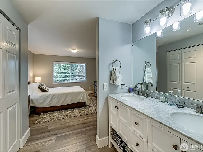 The Primary bathroom has quartz countertops, dual sinks, and ample closet space; even Nordstrom would approve!