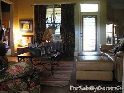 Inviting and warm living area : Buttery, mexican gold walls , and many custom features make this a g