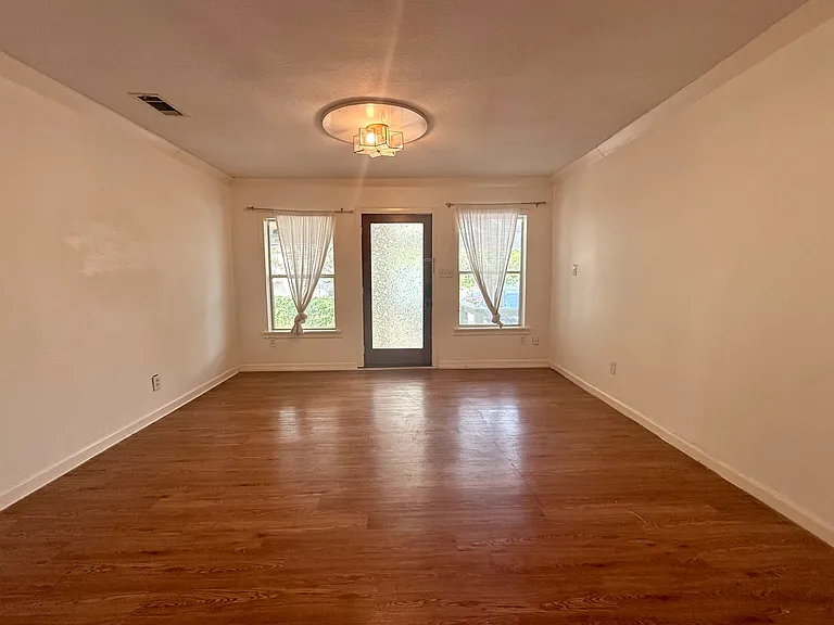 Standing near the kitchen island, looking back toward front door.