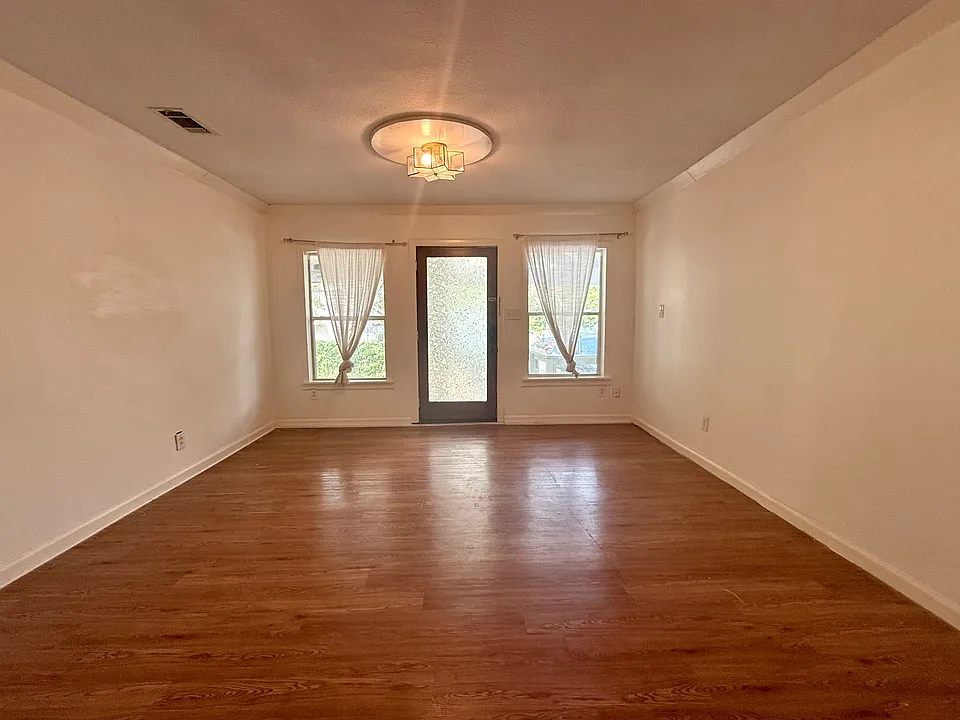 Standing near the kitchen island, looking back toward front door.

From front door to kitchen island measures approx 29' long, with living room area 13'6" wide and dining room area 9'3" wide.