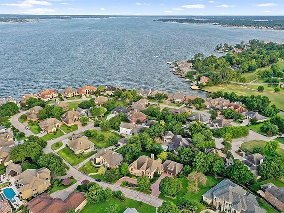 This dream home is located in the highly desirable subdivision of Bentwater on Lake Conroe.