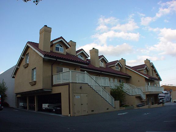 Carport parking at back of the apartment building.