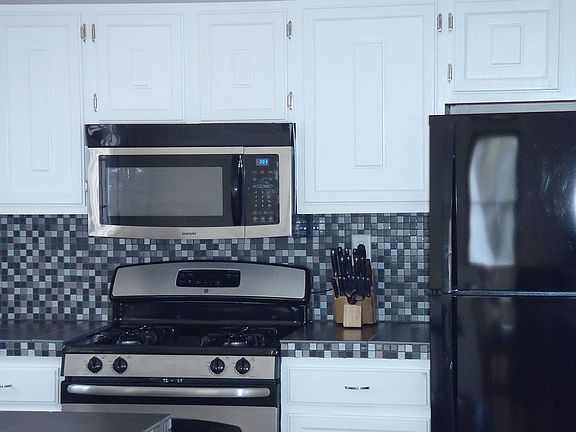  Updated appliances with stainless steel accents.