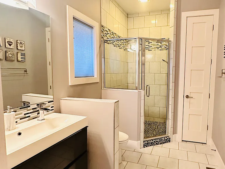 This is the ensuite bathroom connected to the first floor bedroom.