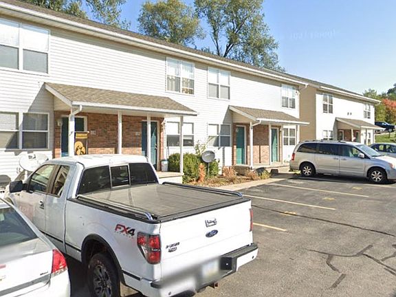 Front door with two assigned parking spots