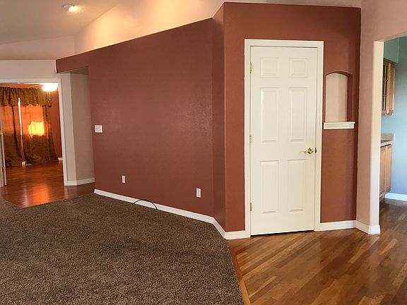 Entry, coat/storage closet, view to 2nd BR