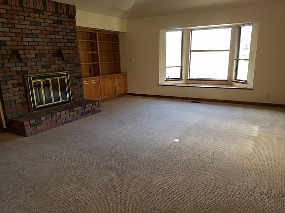 Light and Spacious Living Room with Fireplace
