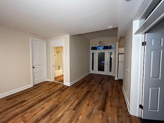 Living space looking back at private entry and bathroom.
