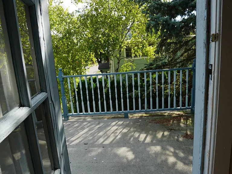 Door to roof patio off of bedroom number three