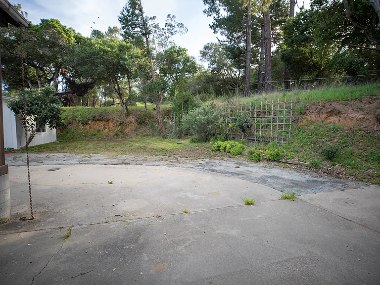 Backyard area built into hillside fully concreted