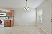 Spacious Dining area with lots of light, tile floors