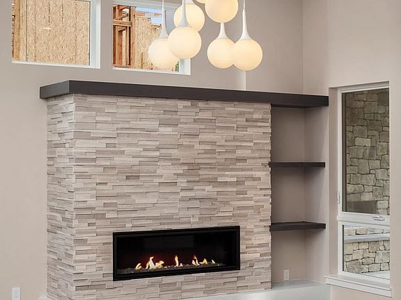 You will love this beautiful gas fireplace with up-lights on