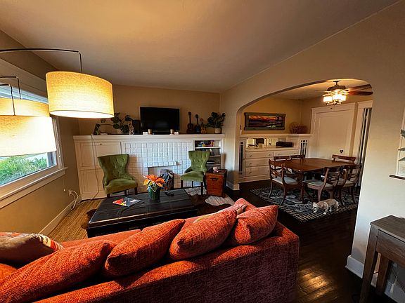 Living area. Built-in desk, book-cases, and faux fireplace.