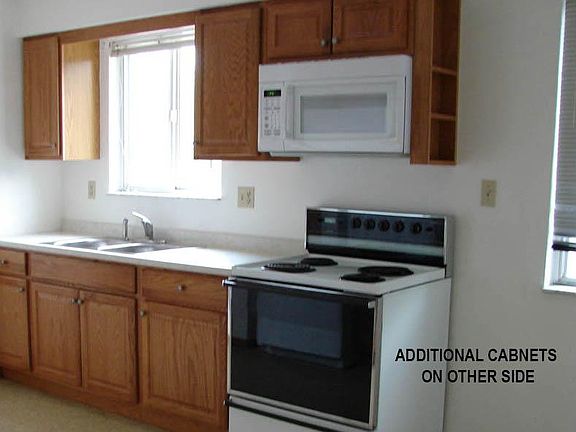 REAR WALL OF KITCHEN, MORE CABINETS ON OPPOSITE WALL