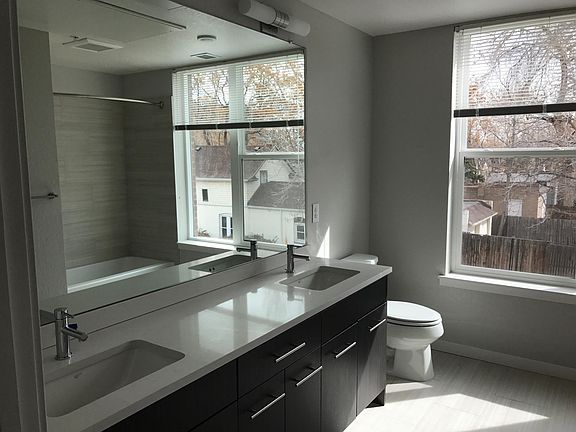 Double-sink bathroom with large window