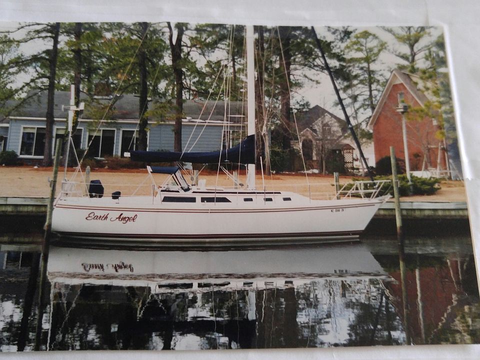 Dock with 34-foot sailboat